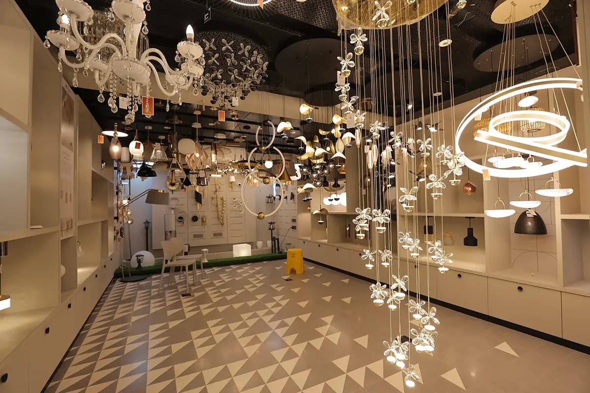 Chandeliers and pendant lights glowing in the AMI Lighting decorative hall